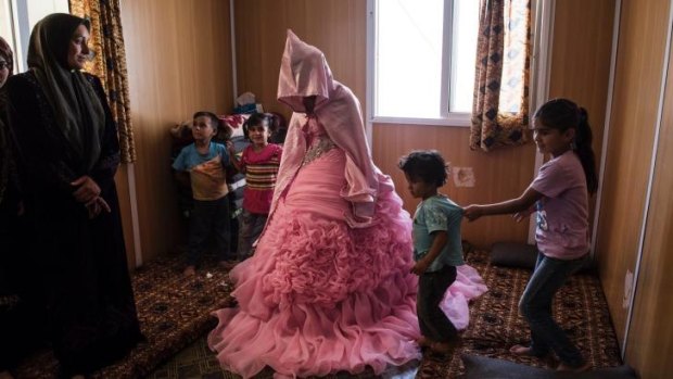 Rahaf Yousef, 13, a Syrian refugee, at home on the day of her engagement party in the Zaatari camp.
