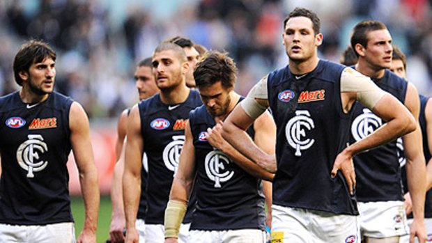 Carlton players show their disappointment after their loss to Collingwood last Saturday.