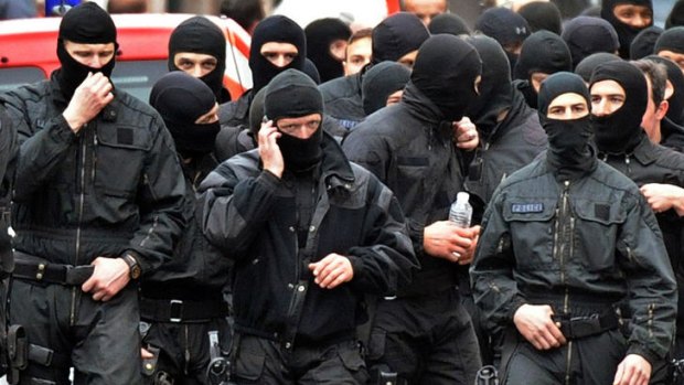 French members of the RAID special police forces unit leave after the assault on the besieged flat of self-professed Al-Qaeda militant Mohammed Merah.