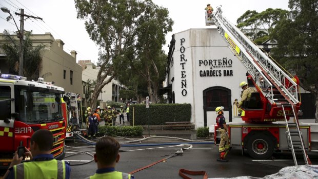 Firefighters extinguishing the blaze at Porteno, 2015.