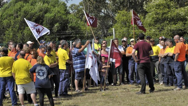 Schweppes workers meet after being locked out of the Tullamarine factory last Thursday.