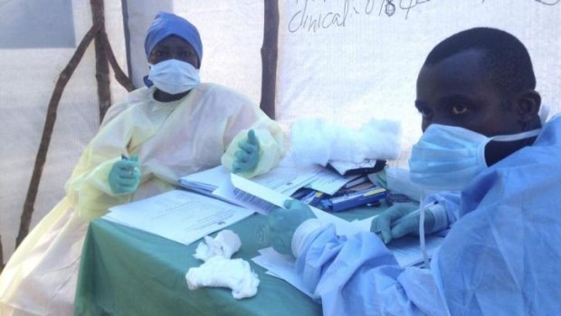 Health workers administer blood tests for the ebola virus in Kenema, Sierra Leone.