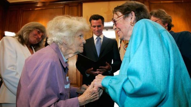 Octogenarians Del Martin, left, and Phyllis Lyon marry in the first legal same-sex marriage ceremony at San Francisco City Hall. California performed its first legally recognised same-sex weddings yesterday.