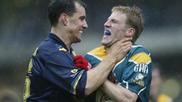 Warren Tredrea gets to know Ireland's Anthony Lynch in 2002.