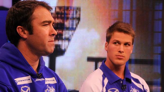 North Melbourne coach Brad Scott with captain Andrew Swallow yesterday.