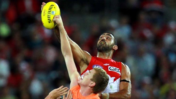 Sydney rivalry &#8230; Adam Goodes of the Swans soars for the ball in last night's match against the Giants.