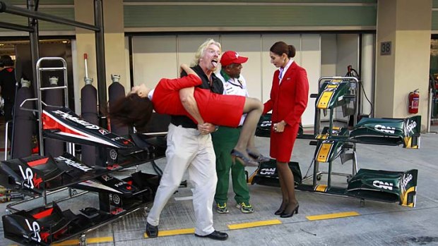 Richard Branson will finally wear a female flight attendant uniform and serve passengers on an AirAsia flight after losing a a bet with Lotus Racing's team owner and AirAsia CEO Tony Fernandes in 2010.