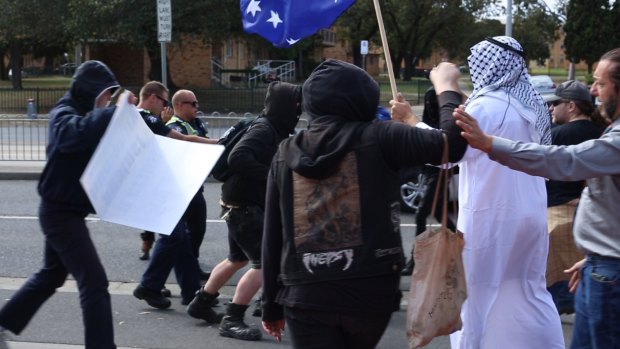 Protesters - including one dressed as a sheik - clash outside the Halal festival in Ascot Vale. 