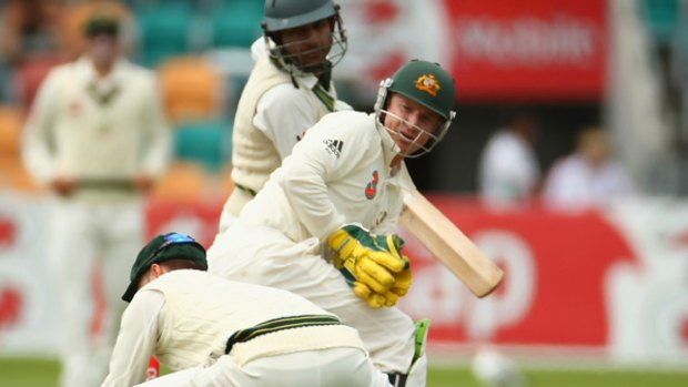 Michael Clarke swoops at first slip to dismiss Sarfraz Ahmed.