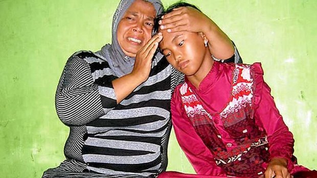 Emotional reunion: Jamaliah (left) with her daughter Raudhatul, thought killed in the 2004 tsunami.