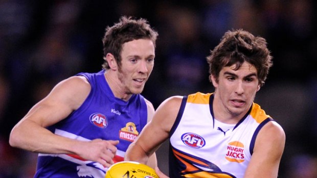 The Western Bulldogs' Robert Murphy chases West Coast's Andrew Gaff in the clubs' game last year.