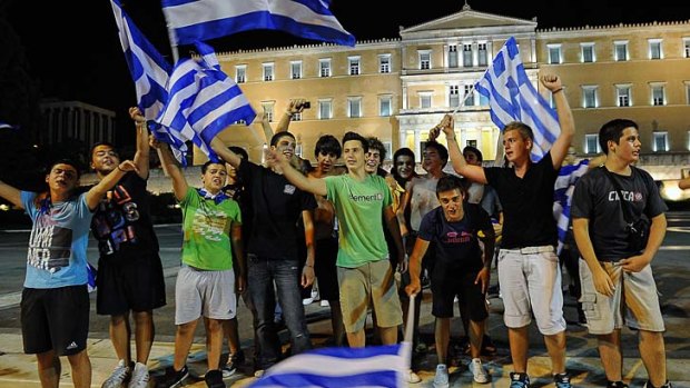 Greeks find something to cheer about at last as their national football team takes out Russia to advance to the quarter-finals at the Euro 2012 championships.