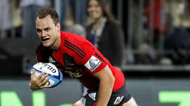 Israel Dagg of the Crusaders runs in to score the match-winning try.