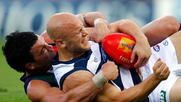 Ryan Crowley and Gary Ablett get up close and personal. Dockers coach Ross Lyon reckons Ablett and the Gold Coast Suns lack respect for Fremantle.
