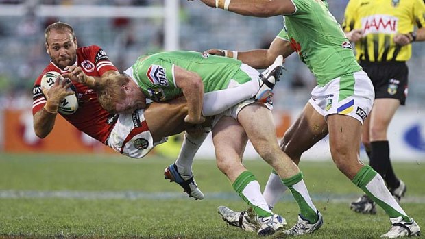 Down for the count: Jason Nightingale is upended at Canberra Stadium last night.