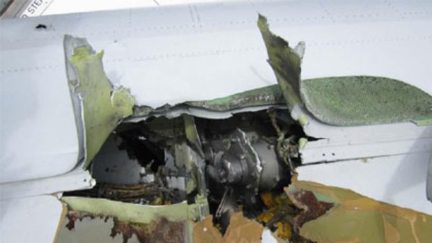 One of the new photos posted on the internet dramatically illustrates how flying metal tore apart QF32's wing.