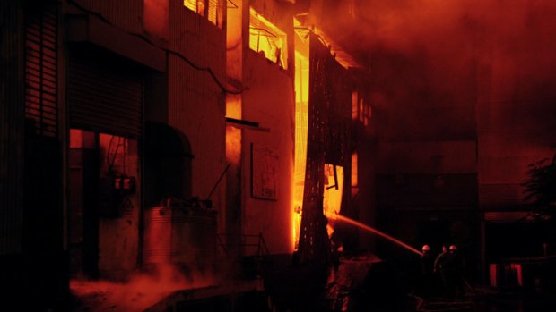 Firefighters tackle the huge blaze in Karachi.