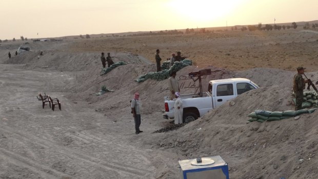 Local tribal fighters dig in against Islamic State militants in the town of Amriyat al-Falluja in Anbar province.