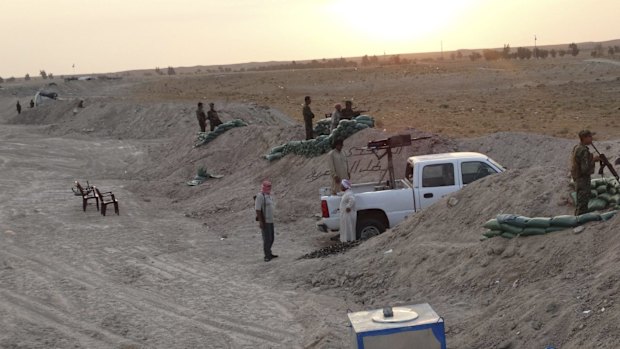 Local tribal fighters dig in against Islamic State militants in the town of Amriyat al-Falluja in Anbar province.