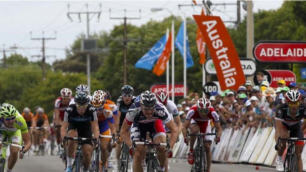 Fight to the finish ... stage winner Andre Greipel pulls in front in yesterday’s Tour Down Under, which was marred by a crash involving 20 cyclists.
