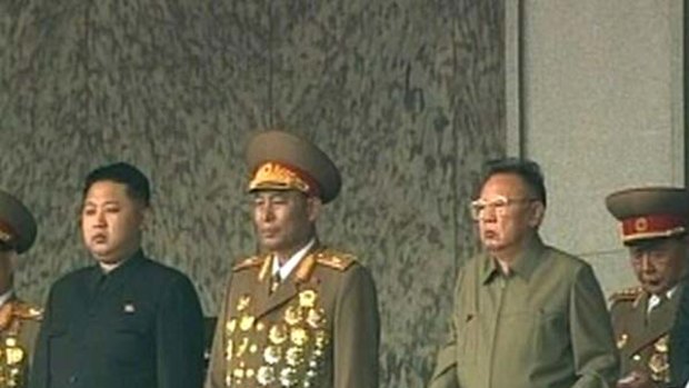 North Korean leader Kim Jong-il (2nd from right) and his youngest son Kim Jong-un (at left) with other officials to commemorate the 65th anniversary of founding of the Workers' Party of Korea.