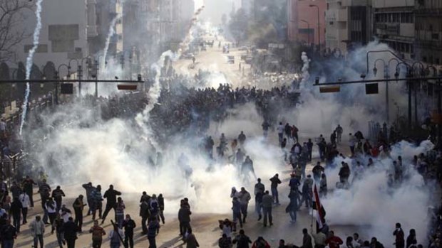 Battlelines ... tear gas is used on crowds in Cairo.