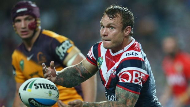 Jake Friend of the Roosters passes during the round 24 NRL match between the Sydney Roosters and the Brisbane Broncos at Allianz Stadium on August 22, 2015 in Sydney.  