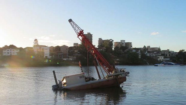 The barge leans at a 30 degree angle in a part of the Brisbane River known as Shafston Reach.