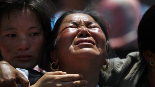 Relatives of mountaineers killed in the avalanche cry during the funeral ceremony in Kathmandu on Monday.