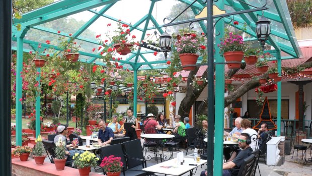 The garden cafe at Kathmandu Guest House is the perfect place to linger in the sun with a drink.