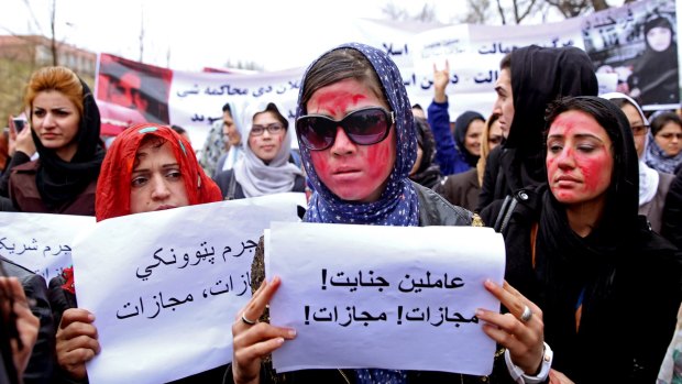 Afghan women demand justice for the  woman who was beaten and burned to death after being falsely accused of burning a Koran.