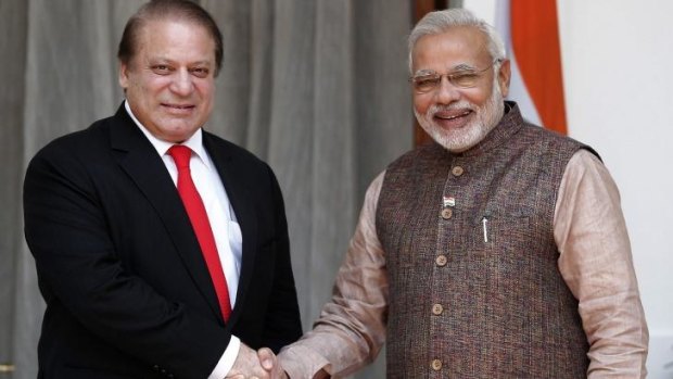 Border tensions: Pakistani Prime Minister Nawaz Sharif, left, shakes hands with Indian Prime Minister Narendra Modi in May.