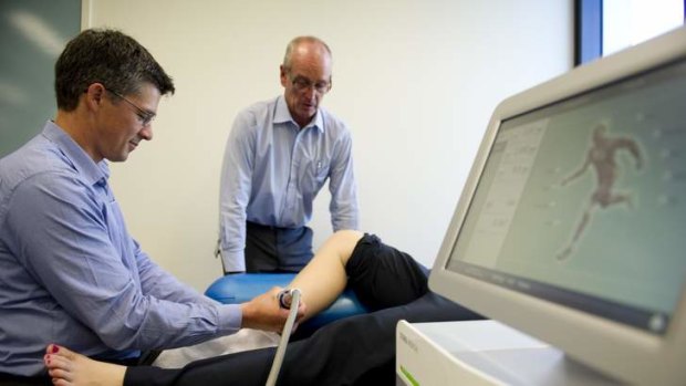 Assistant Professor Physiotherapy Phil Newman and Professor Physiotherapy Gordon Waddington with the Storz Medical Duolith SD1 machine being used to treat Shin Splints.