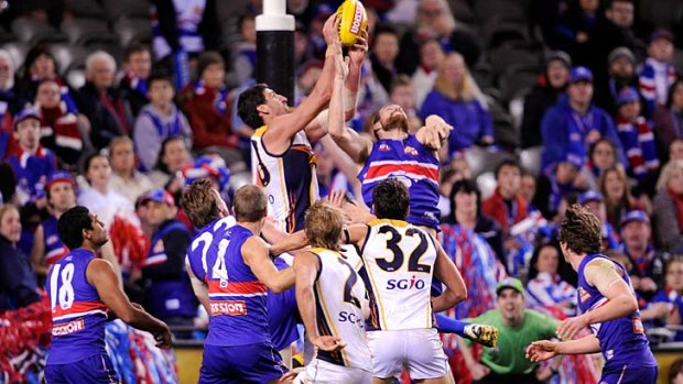 Party pooper: Champion Eagle Dean Cox decides the brilliant round  19 match between the Eagles and the Bulldogs.