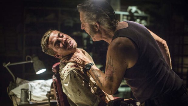Captive audience: arch villain Mick Taylor (John Jarratt) gives his unsuspecting backpack prisoner a piece of his mind in <i>Wolf Creek 2</i>.