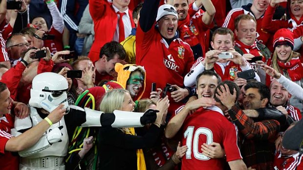 Memorable moment: Jonathan Sexton celebrating with the Lions fans after winning the 3rd Rugby Test.