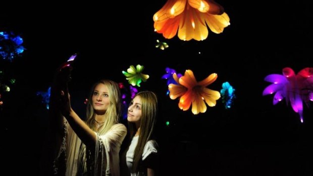 Commonwealth Park will come to life after dark for Floriade NightFest. Talia Liolios, left, of Chisholm, and Laura Mann, of Queanbeyan, in the Triffid Garden.
