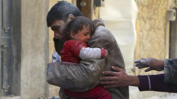 As peace talks stall, ordinary Syrians continue to suffer. A boy holds his baby sister saved from under rubble, who survived what activists say was an airstrike by forces loyal to the regime  in Aleppo.