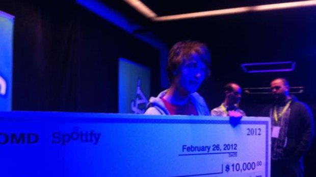 Peter Watts with his $10,000 hackathon cheque.