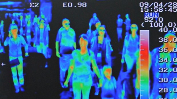 A thermal scanner shows the heat signature of passengers.