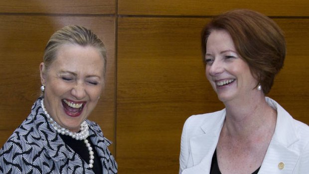 US Secretary of State Hillary Clinton and Prime Minister Julia Gillard find something to laugh about on the sidelines of the summit.