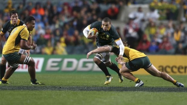 Centurion: Bryan Habana tries to break the Wallabies' line during his hundreth Test match on Saturday.