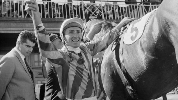 Roy Higgins celebrates after winning the 1967 Melbourne Cup on Red Handed.