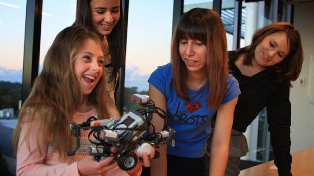 Enthused ... Alyssa Meyers, 10, with Ruby the robot, Hollie Ridler, 14, Irene Tsimos of UNSW, and Catherine Moriarty of Schneider Electrics.
