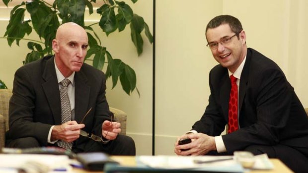 On the offensive ... Senator Stephen Conroy, pictured right, with the head of NBN Co. Mike Quigley has attacked the Productivity Commission.
