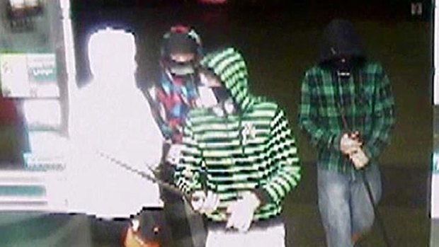 Police wish to speak to these men in relation to a service station robbery.