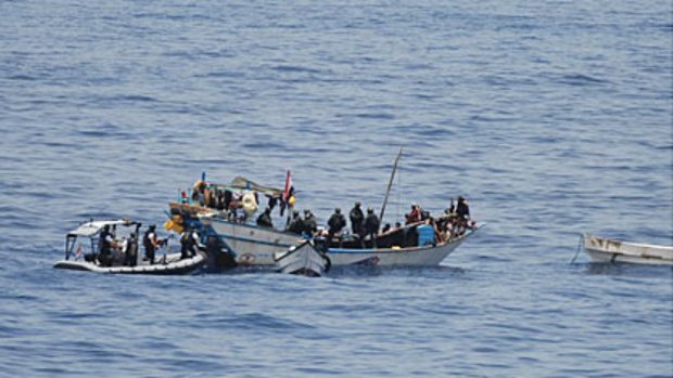 Rescue... Dutch commandos board a Yemeni fishing boat to free its crew and briefly detain nine suspected pirates.