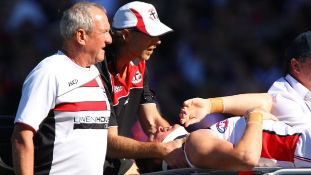 St Kilda's Brendon Goddard is stretchered from the ground against Fremantle on Saturday.