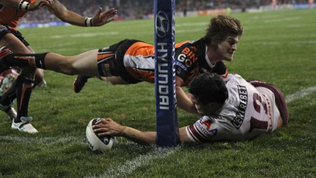 Cornered: Justin Horo plants the ball for one of his two tries on the night.