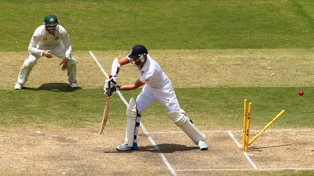 Dismissed: James Anderson is clean bowled by Mitchell Johnson.